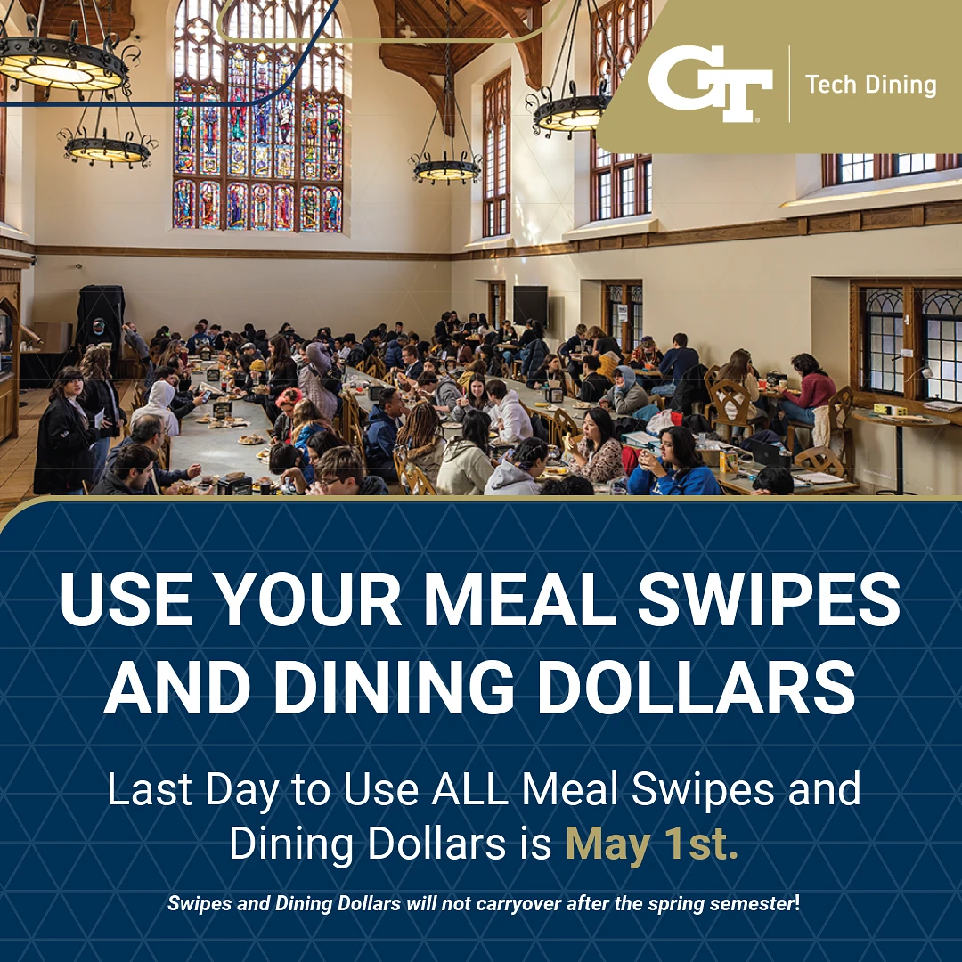 A large group of people are dining together in a hall with a notice reminding them to use their meal swipes and dining dollars before May 1st.